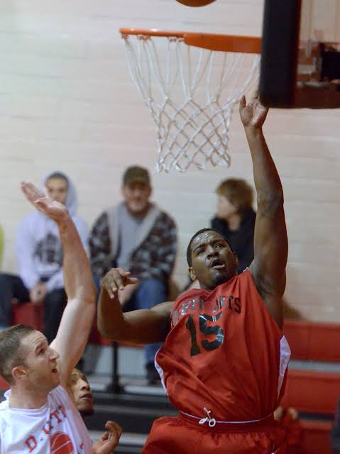 Mighty Ants forward finishing at the rim against Dover City in a regional matchup (Winter 2024)