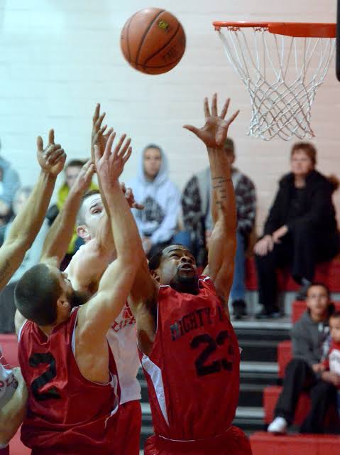 Mighty Ants players crashing the glass for a contested rebound during a home game (Winter 2024)