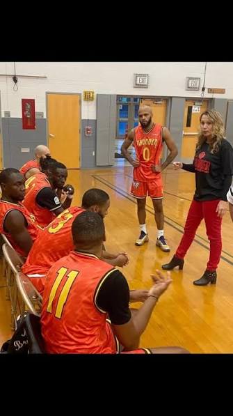 Mighty Ants coaching staff addressing the roster on the bench during a home game (Winter 2024)